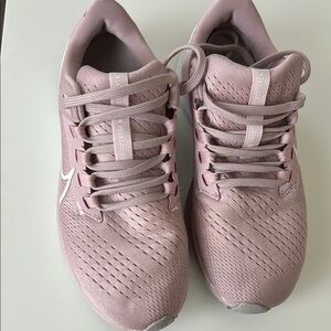 Nike Pink Athletic Shoes with Breathable Fabric and Sleek Design